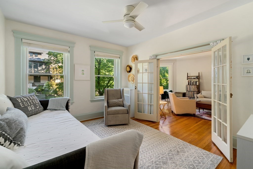 89 Mason Terrace, Unit 3 Brookline, MA 02446 - Photo 6 of 19 a bedroom with furniture and a balcony