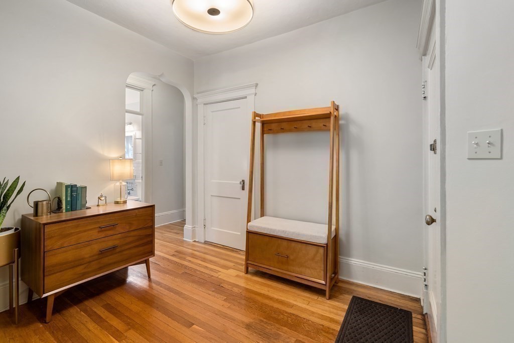 89 Mason Terrace, Unit 3 Brookline, MA 02446 - Photo 8 of 19 a living room with furniture and a wooden floor