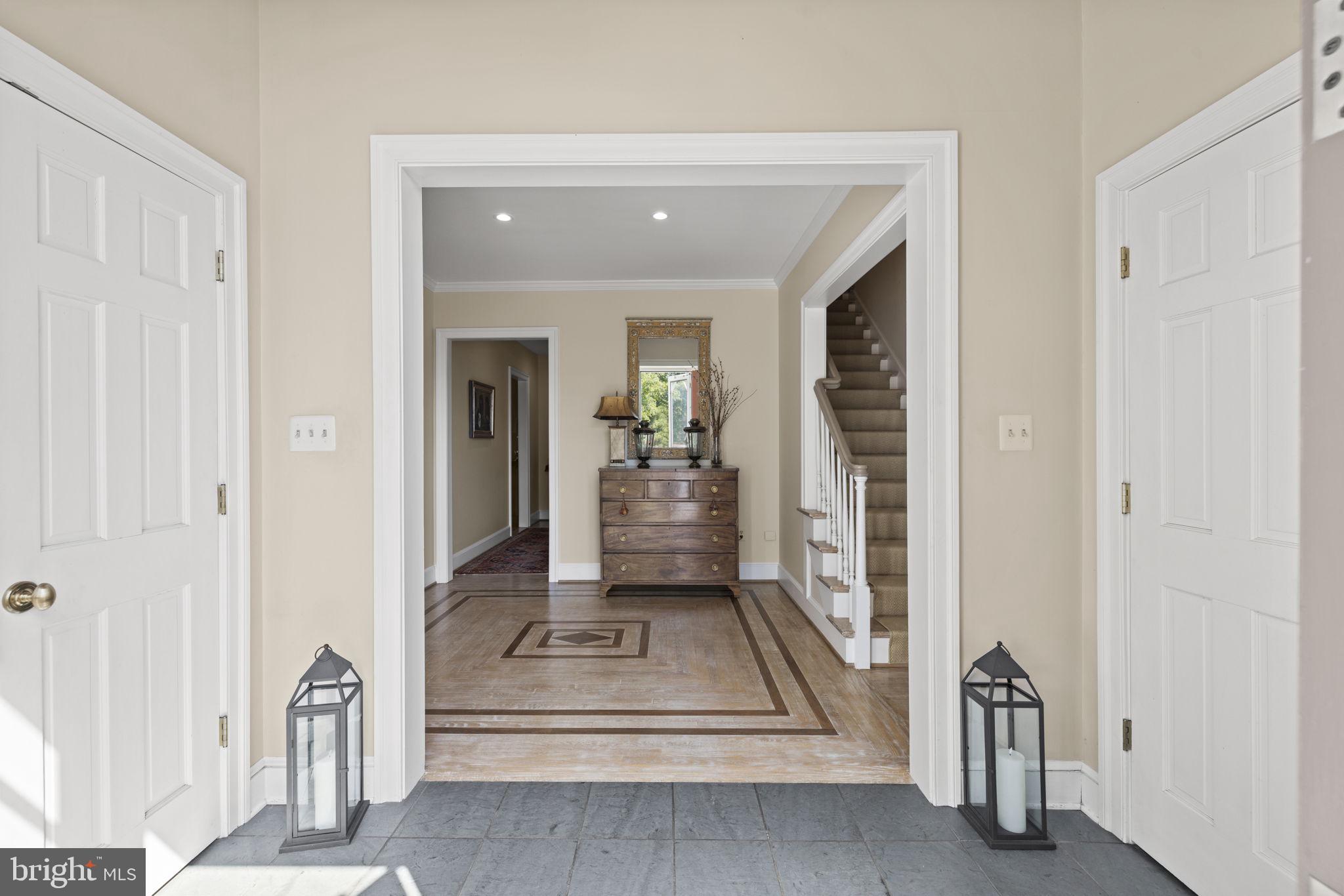 36190 Turkey Roost Road Middleburg, VA 20117 - Photo 9 of 88 a view of a hallway with wooden floor and a living room