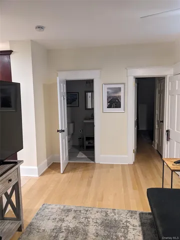 a view of livingroom with hardwood floor and furniture