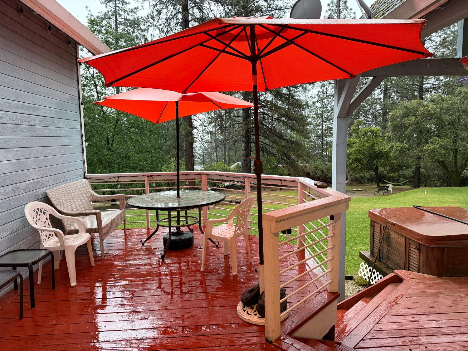 645 Rigby Lane Applegate, CA 95703 - Photo 12 of 52 a view of an outdoor sitting area with furniture and umbrella