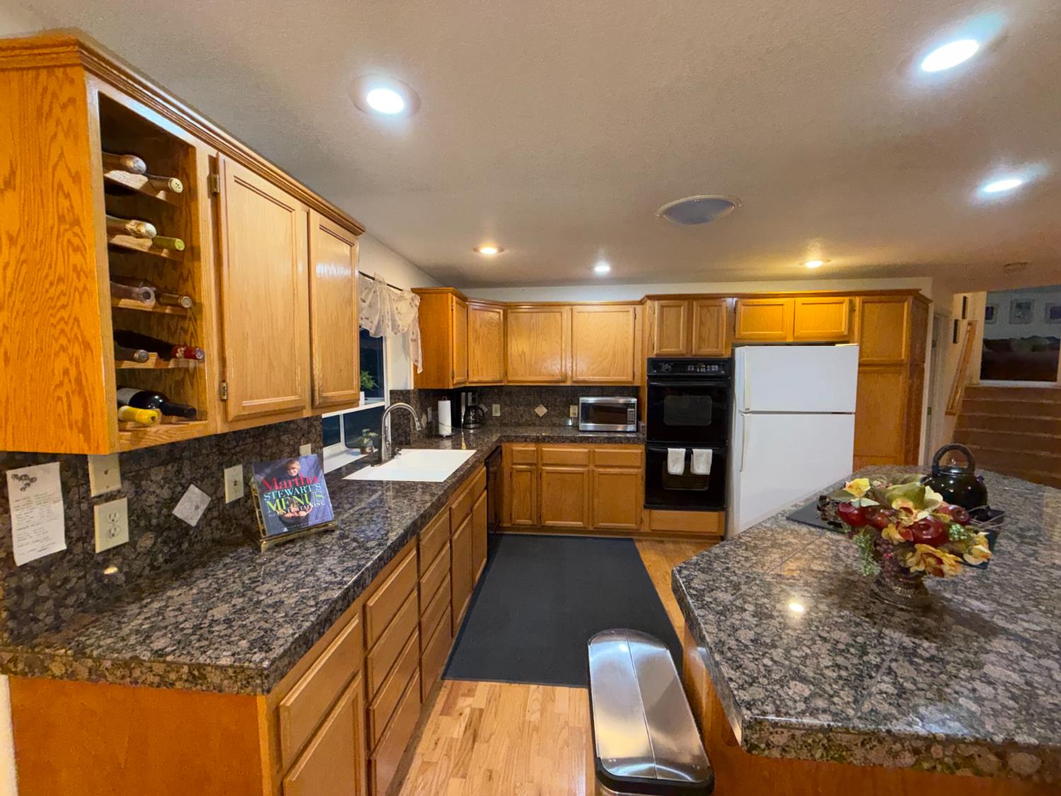 645 Rigby Lane Applegate, CA 95703 - Photo 23 of 52 a kitchen with stainless steel appliances granite countertop a sink stove and refrigerator