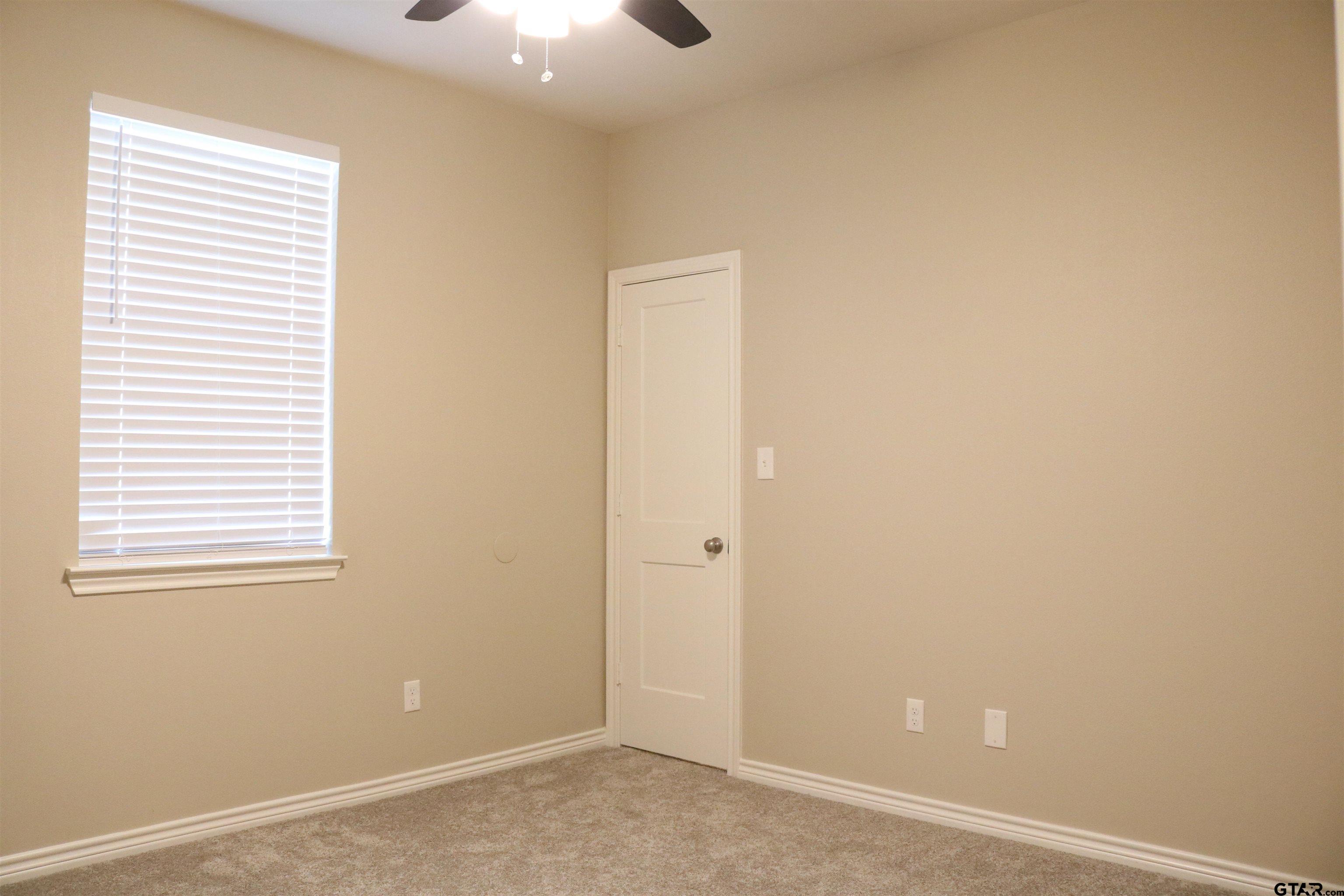 3915 Old Omen Road Tyler, TX 75707 - Photo 11 of 19 an empty room with windows