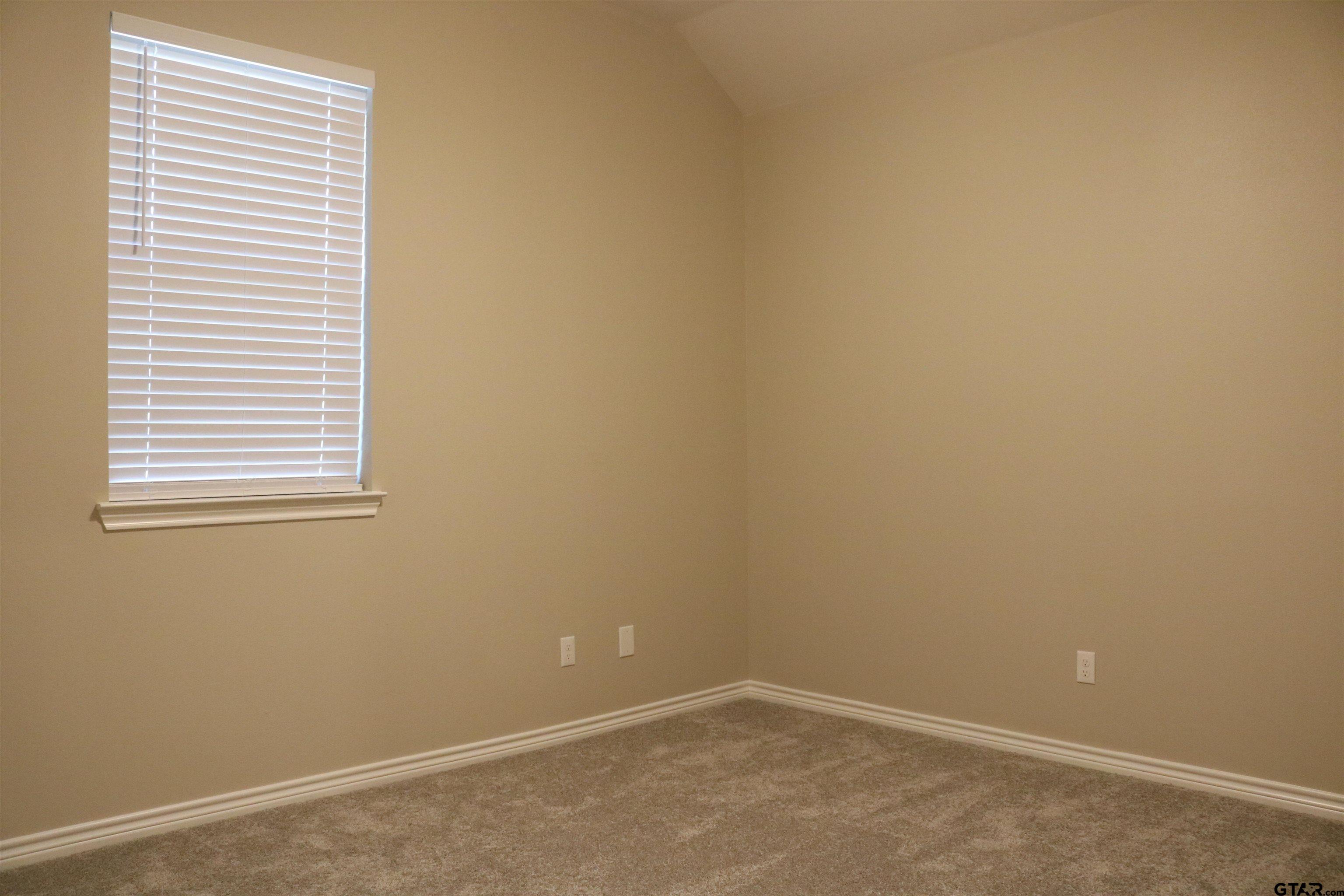 3915 Old Omen Road Tyler, TX 75707 - Photo 16 of 19 an empty room with a window