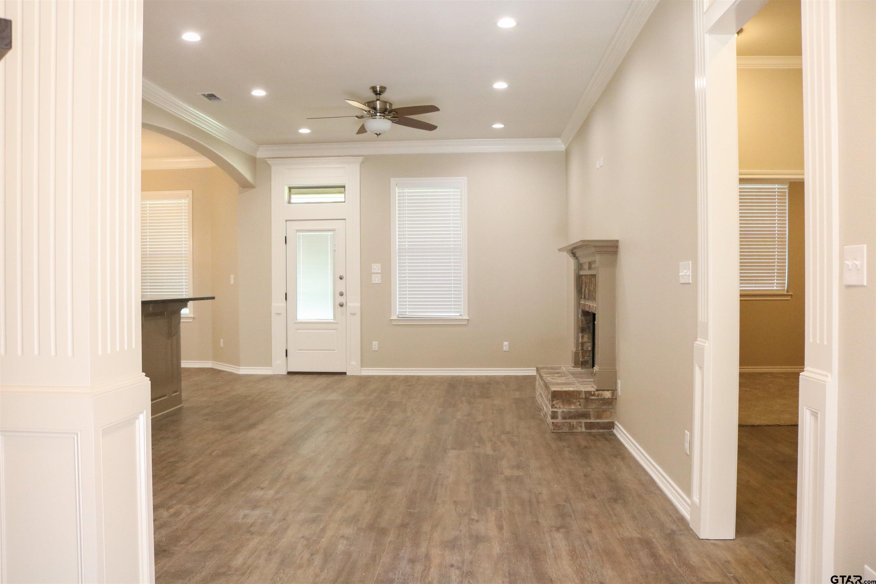 3915 Old Omen Road Tyler, TX 75707 - Photo 3 of 19 a view of empty room with wooden floor