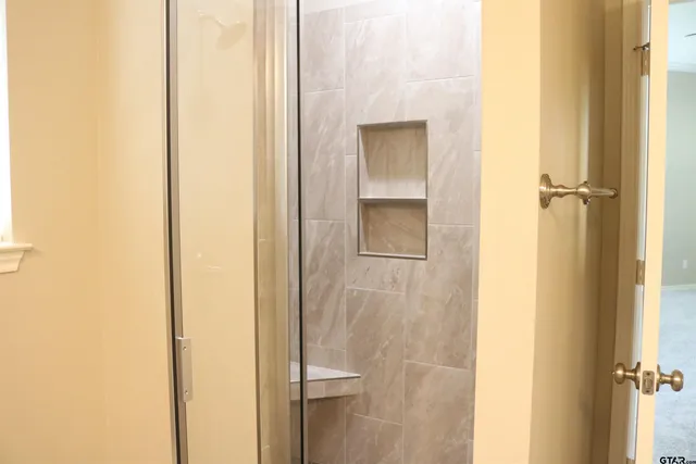 a view of a bathroom from a hallway