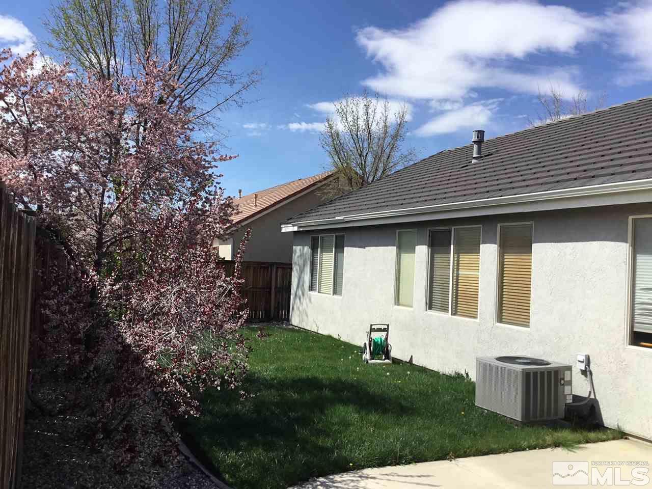 1432 Gaucho Lane Reno, NV 89521 - Photo 11 of 13 a front view of a house with garden