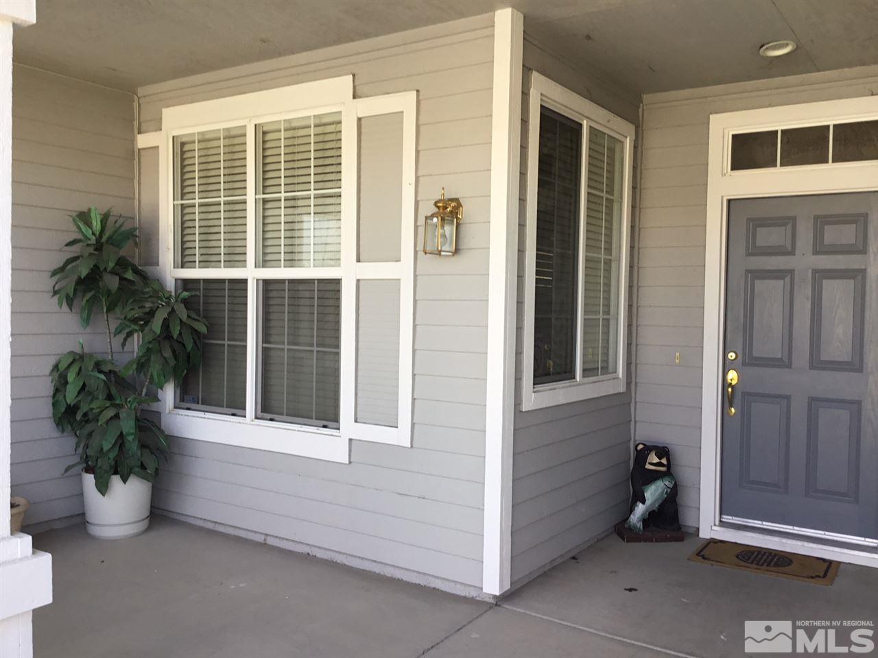 1432 Gaucho Lane Reno, NV 89521 - Photo 5 of 13 a potted plant sitting in front of a house