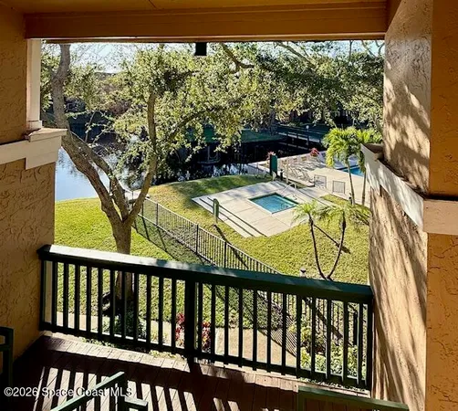 a kitchen with granite countertop a refrigerator stove and microwave