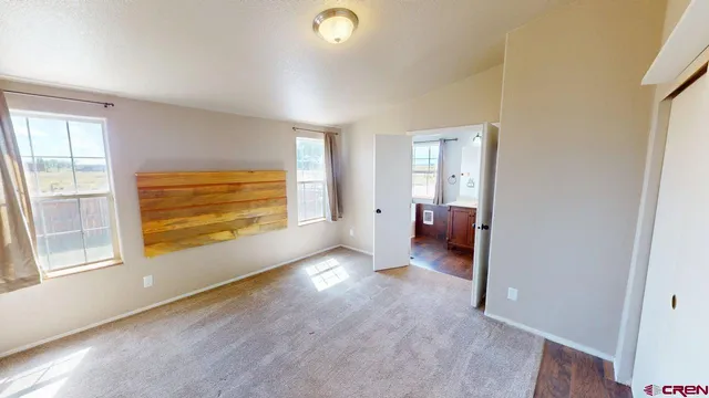 wooden floor in a room next to a window