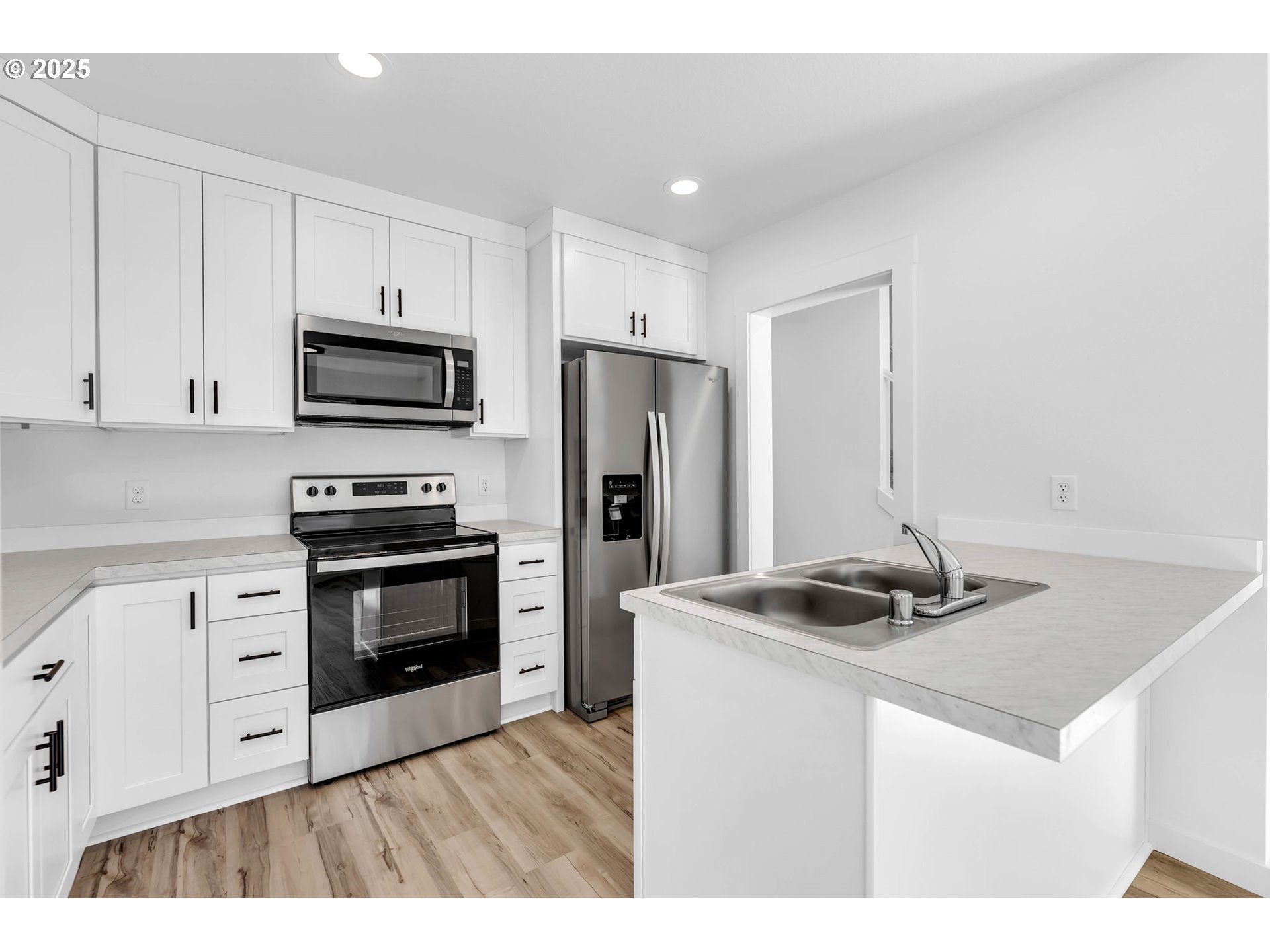 805 West Front Street Winlock, WA 98596 - Photo 11 of 31 a kitchen with kitchen island a sink appliances and cabinets