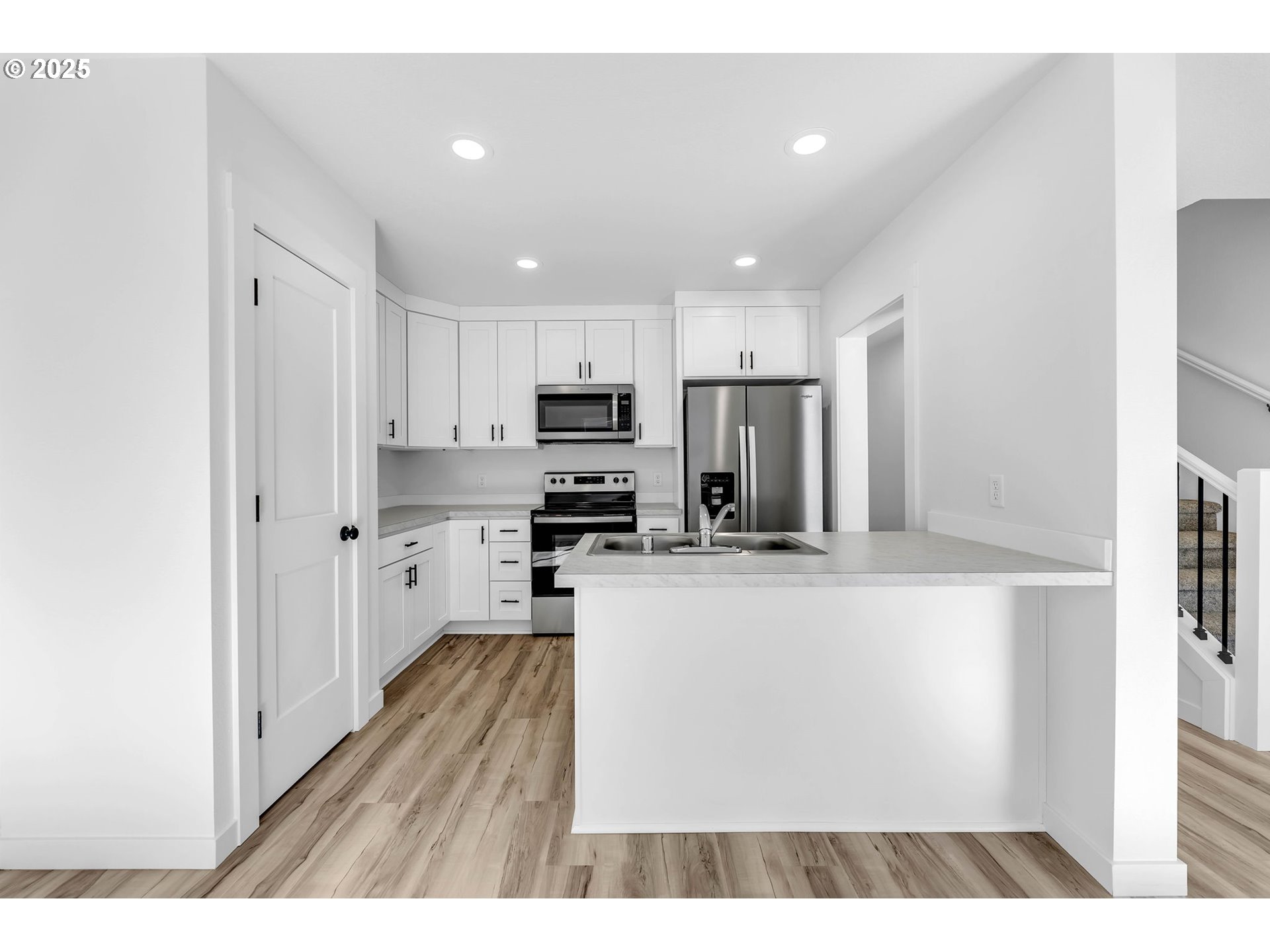 805 West Front Street Winlock, WA 98596 - Photo 16 of 31 a kitchen with stainless steel appliances a refrigerator and a stove top oven