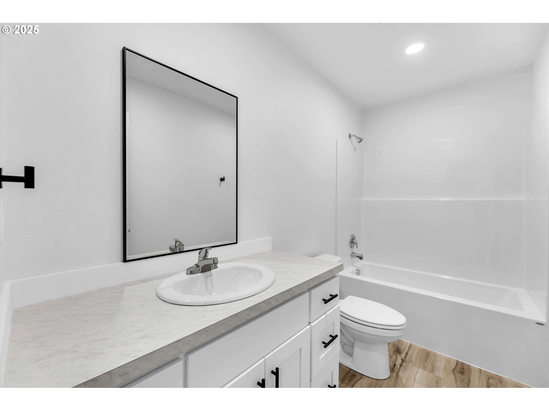805 West Front Street Winlock, WA 98596 - Photo 22 of 31 a bathroom with a granite countertop sink toilet a mirror and shower