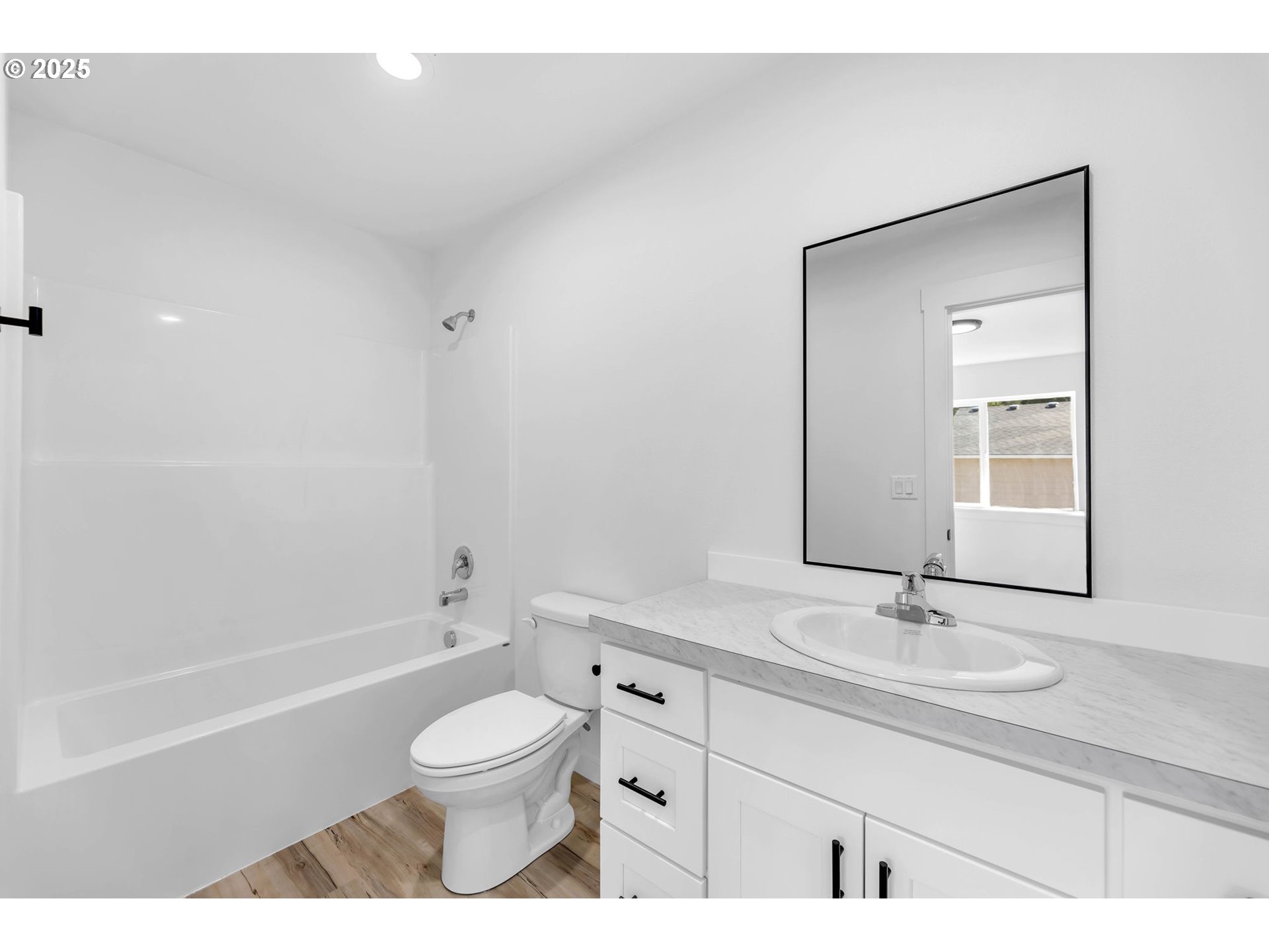 805 West Front Street Winlock, WA 98596 - Photo 28 of 31 a bathroom with a granite countertop sink toilet a large mirror and shower