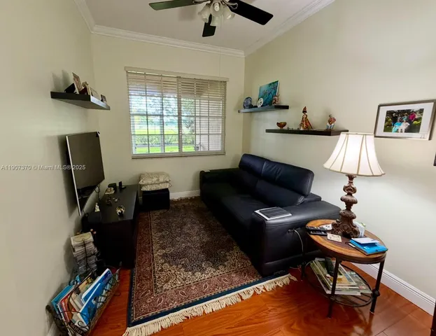 a living room with furniture rug and window