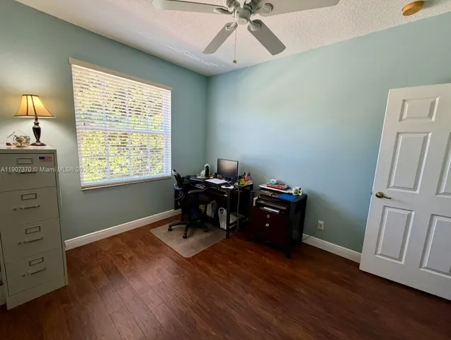 a room with furniture and wooden floor