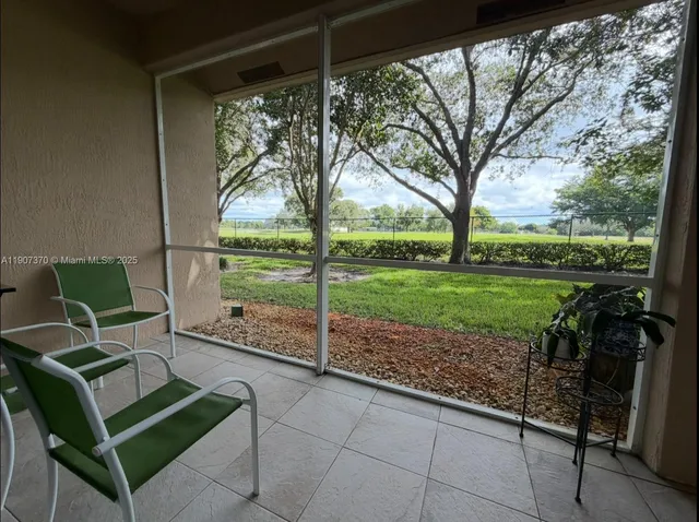 a garden view with a seating space