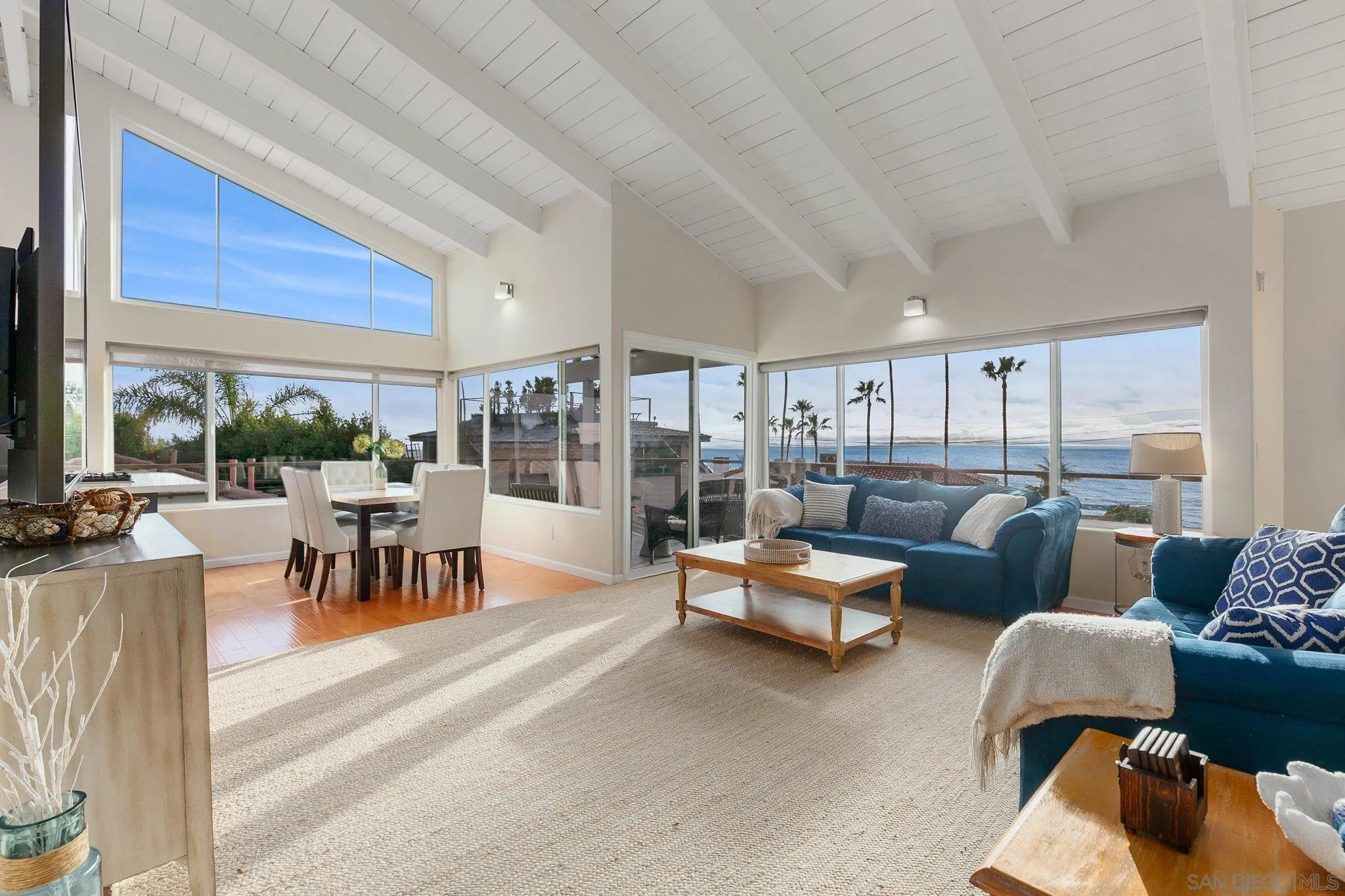 5620 La Jolla Boulevard La Jolla, CA 92037 - Photo 12 of 50 a living room with furniture and a large window