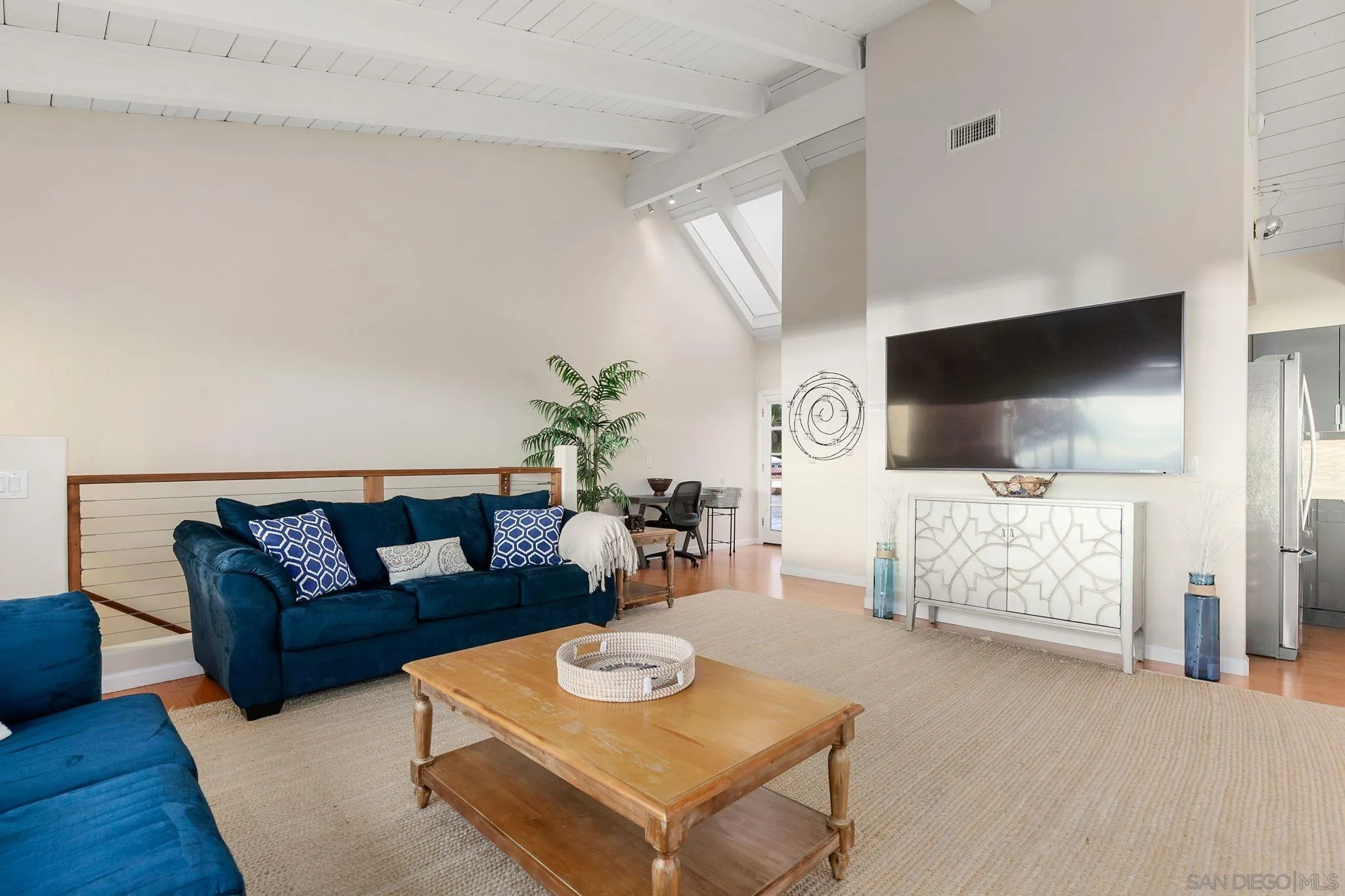 5620 La Jolla Boulevard La Jolla, CA 92037 - Photo 15 of 50 a living room with furniture and a flat screen tv