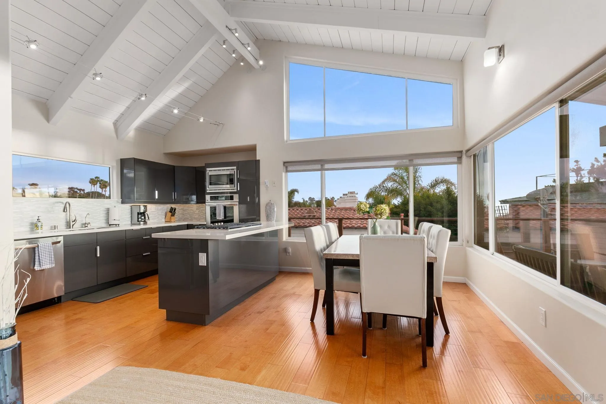 5620 La Jolla Boulevard La Jolla, CA 92037 - Photo 16 of 50 a large kitchen with a table and chairs