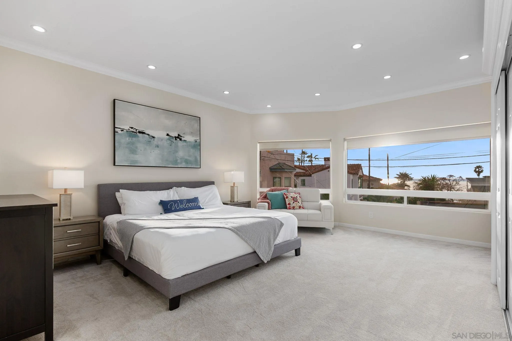 5620 La Jolla Boulevard La Jolla, CA 92037 - Photo 21 of 50 a spacious bedroom with a bed and window