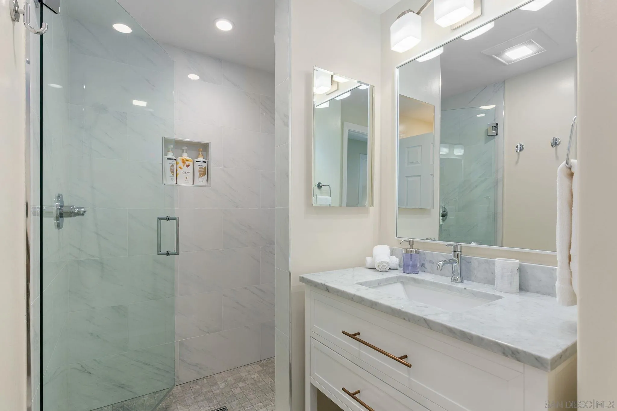 5620 La Jolla Boulevard La Jolla, CA 92037 - Photo 25 of 50 a bathroom with a granite countertop sink mirror and double
