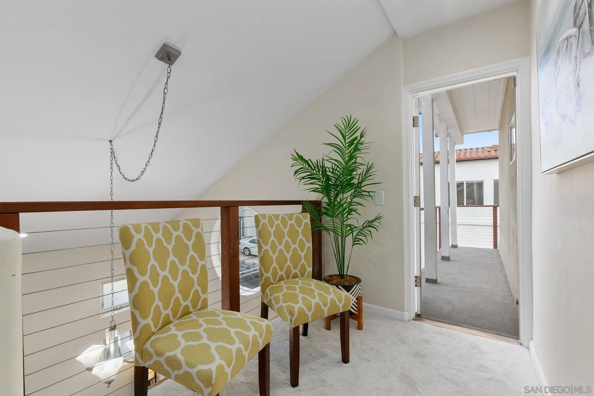 5620 La Jolla Boulevard La Jolla, CA 92037 - Photo 26 of 50 a living room with furniture and a potted plant
