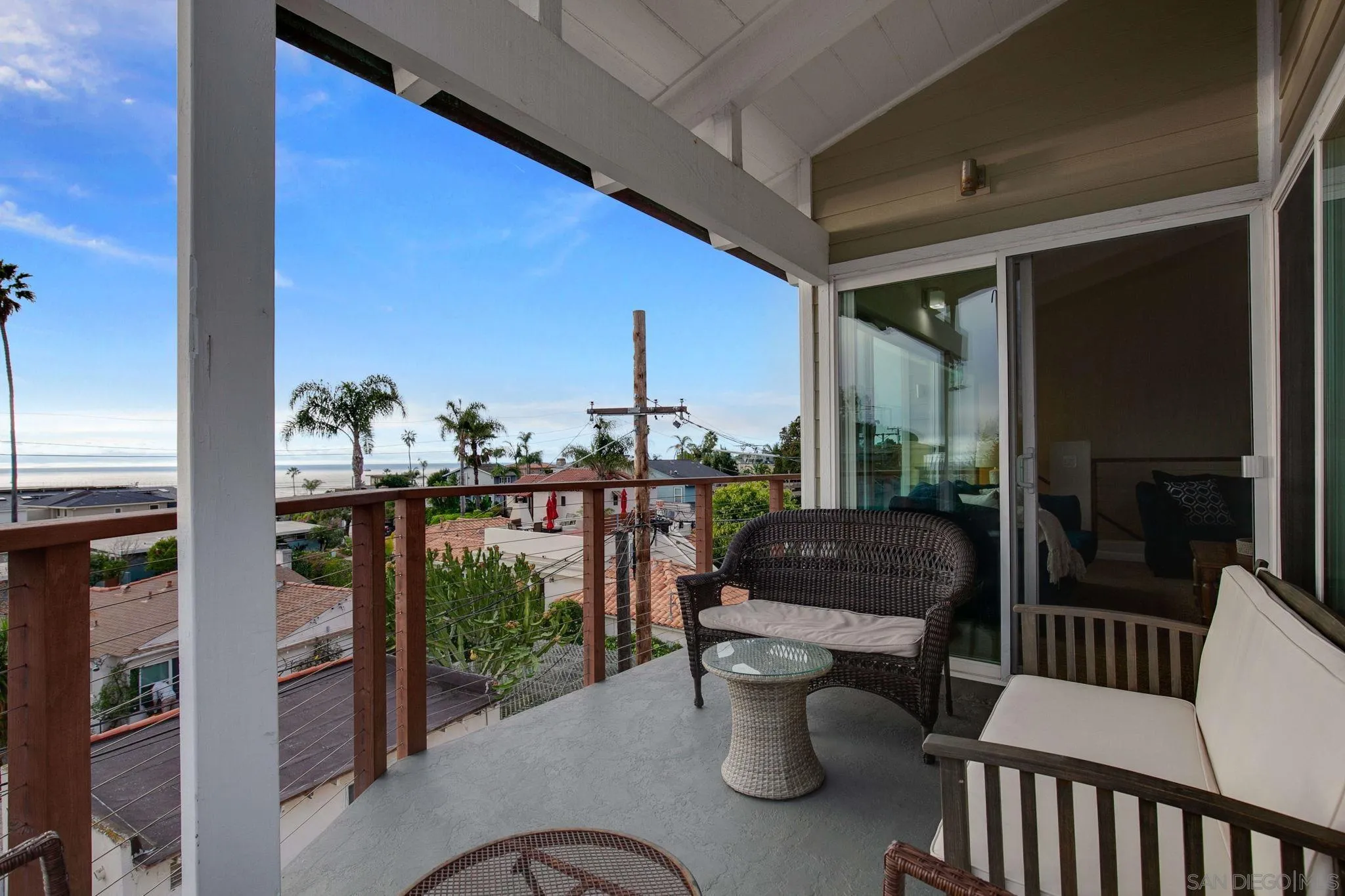 5620 La Jolla Boulevard La Jolla, CA 92037 - Photo 9 of 50 a balcony with furniture and a potted plant