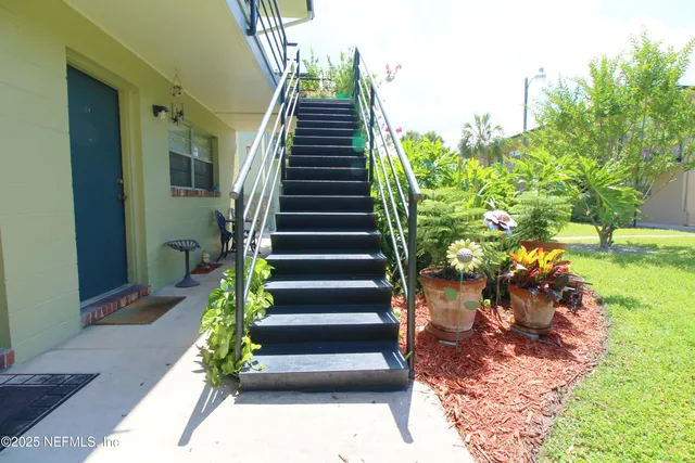 a view of stairs and yard