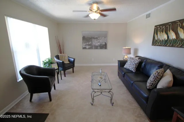 a living room with furniture and a window
