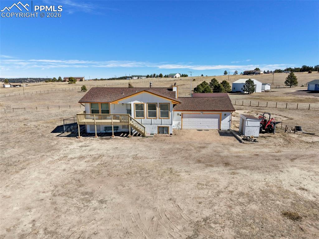 an aerial view of a house with a garden space