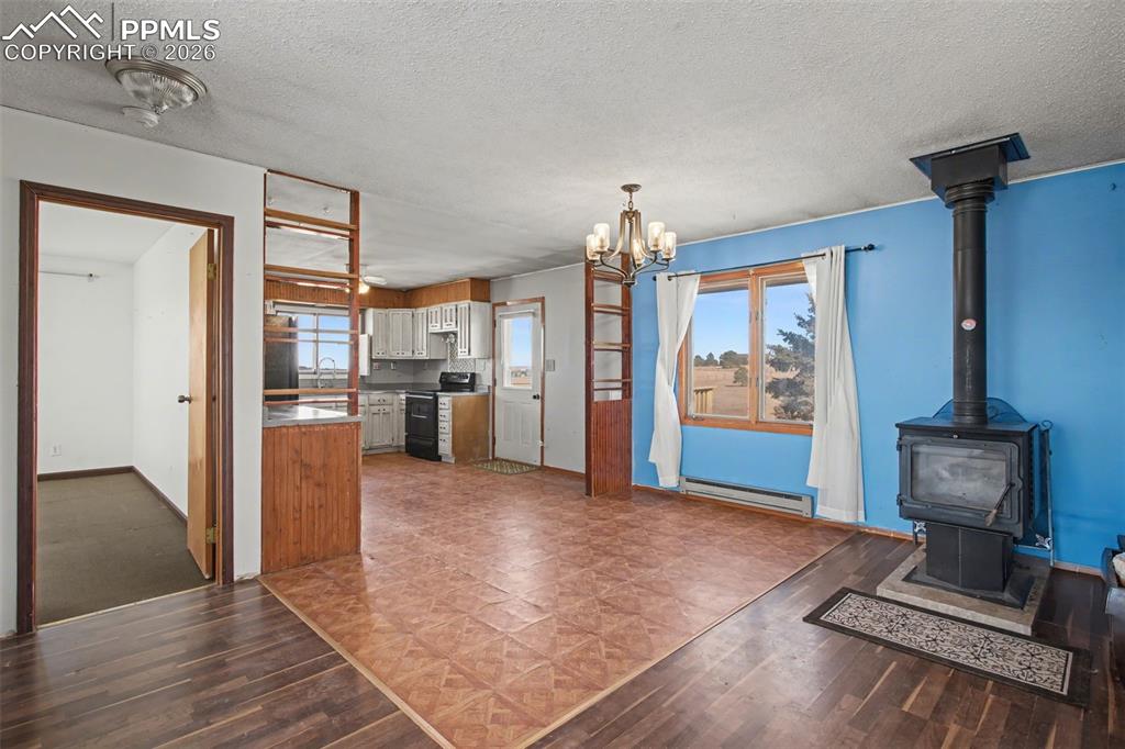 12380 Old Barn Road Elbert, CO 80106 - Photo 14 of 42 a view of a kitchen with furniture and an empty room