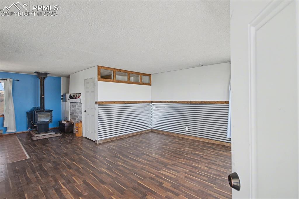 12380 Old Barn Road Elbert, CO 80106 - Photo 17 of 42 a view of a livingroom with wooden floor and furniture