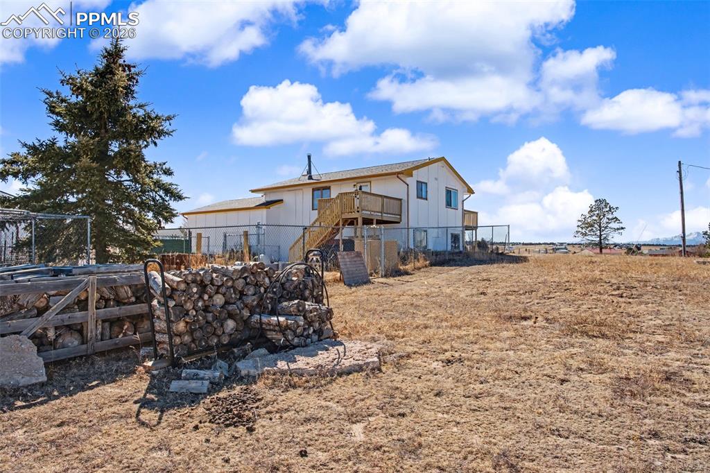 12380 Old Barn Road Elbert, CO 80106 - Photo 35 of 42 a view of a house with a yard