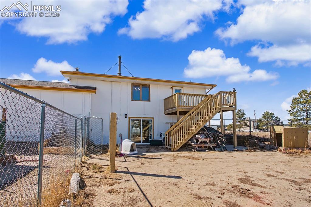12380 Old Barn Road Elbert, CO 80106 - Photo 36 of 42 a view of a roof deck with chair and tables