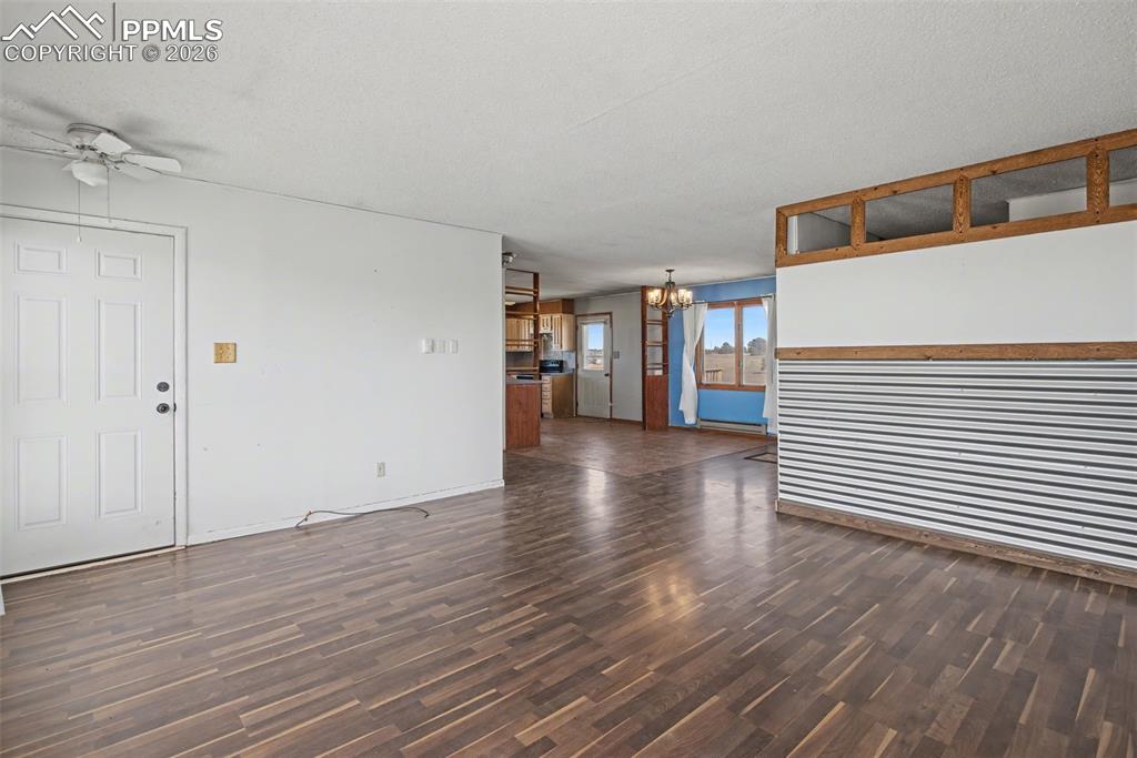 12380 Old Barn Road Elbert, CO 80106 - Photo 5 of 42 a view of a livingroom with wooden floor