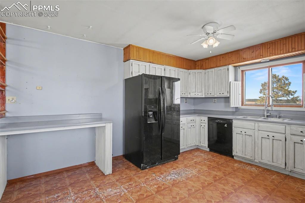 12380 Old Barn Road Elbert, CO 80106 - Photo 8 of 42 a kitchen with a refrigerator and a sink