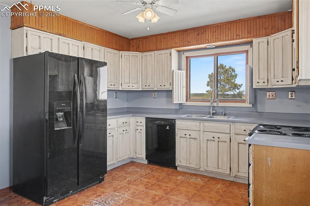 12380 Old Barn Road Elbert, CO 80106 - Photo 9 of 42 a kitchen with stainless steel appliances granite countertop a refrigerator sink and cabinets