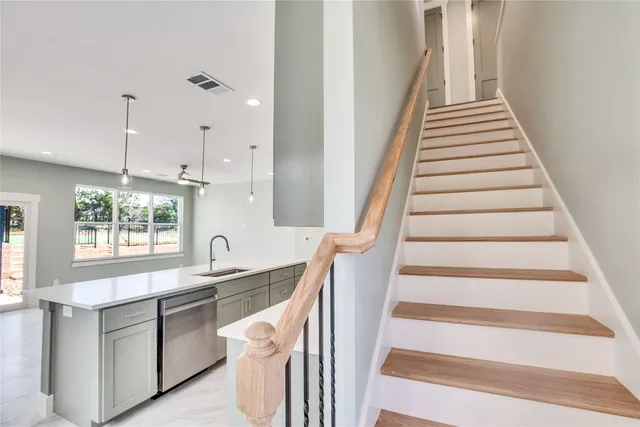a kitchen with a sink and a window