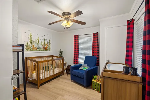 a bedroom with a bed and a book shelf