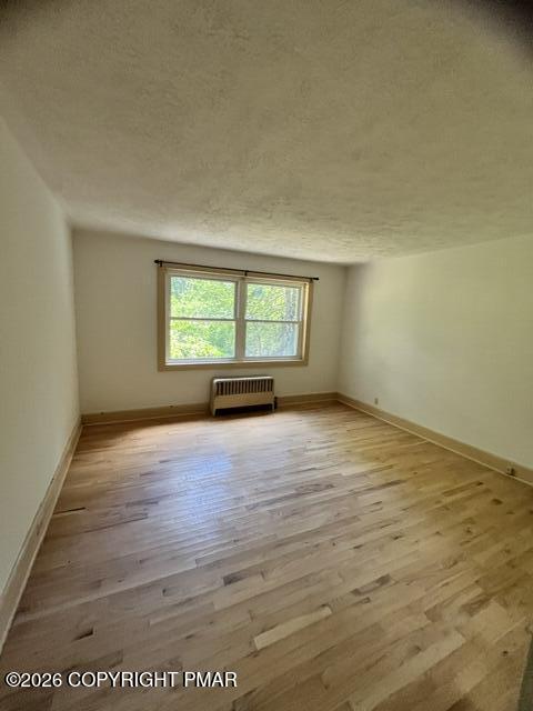 101 Knob Road Mount Pocono, PA 18344 - Photo 16 of 18 an empty room with wooden floor and windows