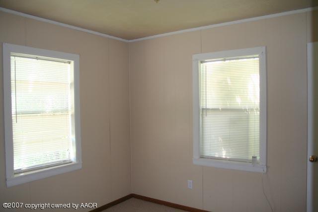 4331 South Polk Street Amarillo, TX 79110 - Photo 5 of 9 an empty room with a window