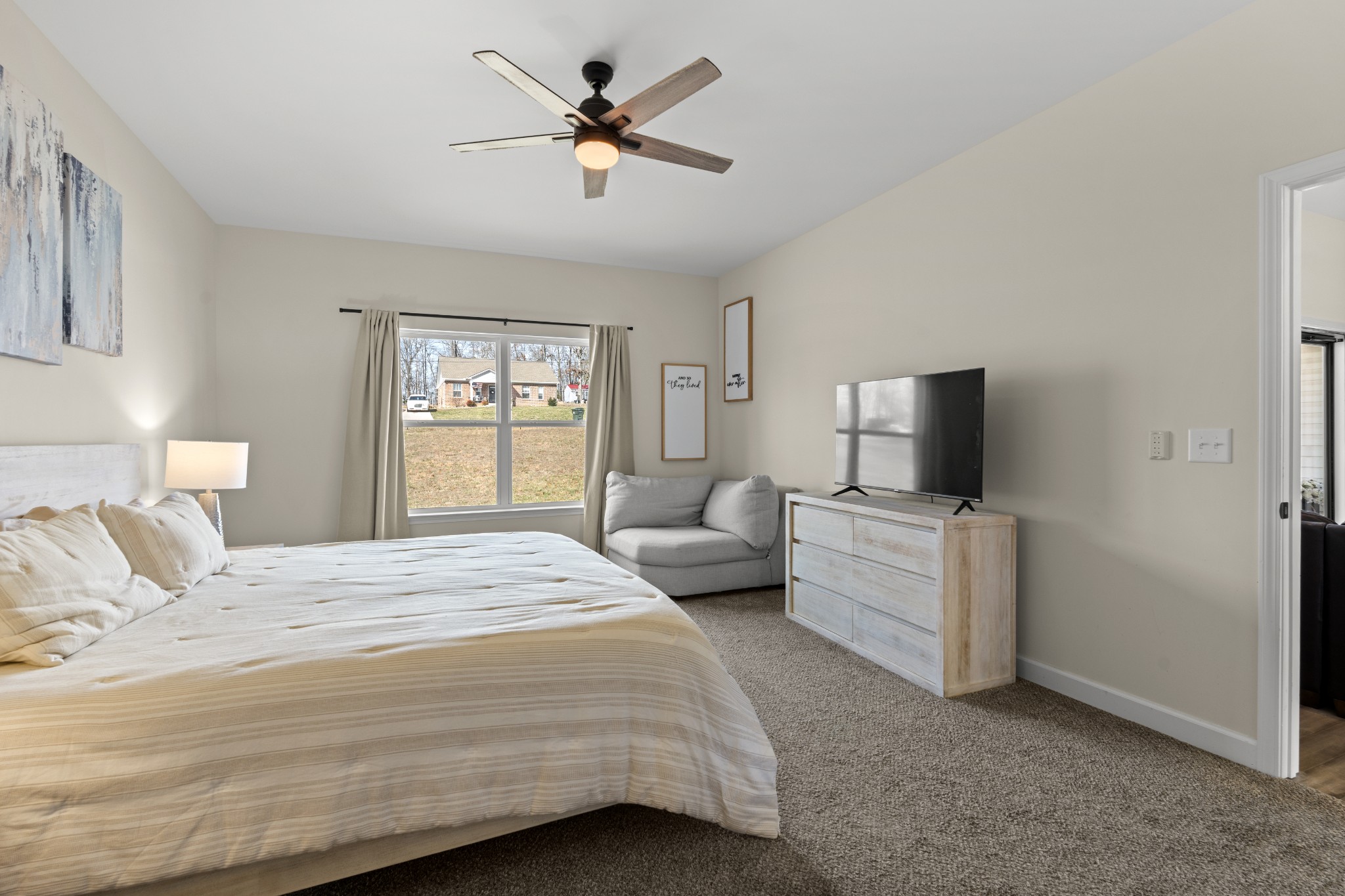 1007 Edgewood Drive Dickson, TN 37055 - Photo 12 of 25 a spacious bedroom with a bed and a flat screen tv