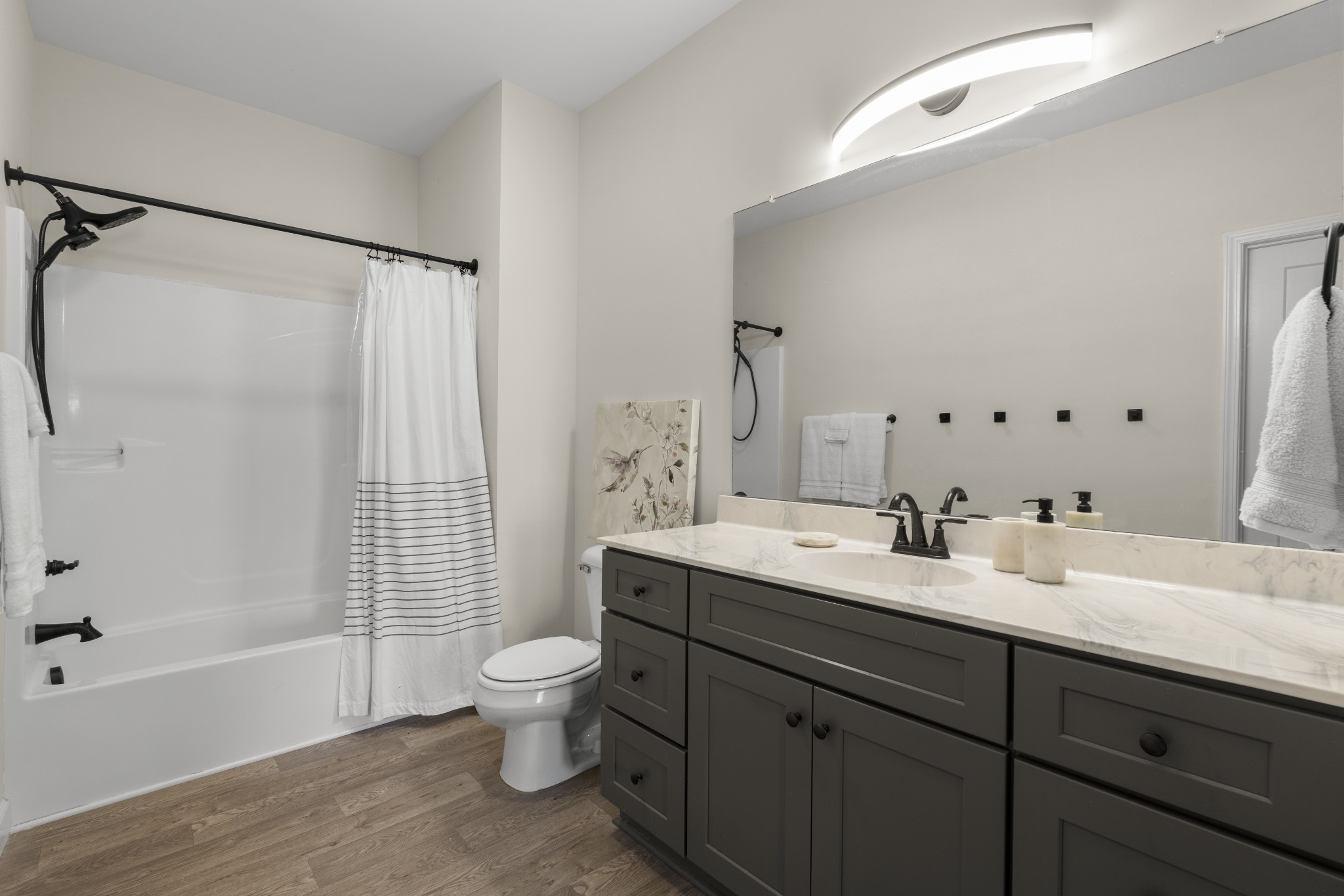 1007 Edgewood Drive Dickson, TN 37055 - Photo 13 of 25 a bathroom with a double vanity sink toilet mirror and shower