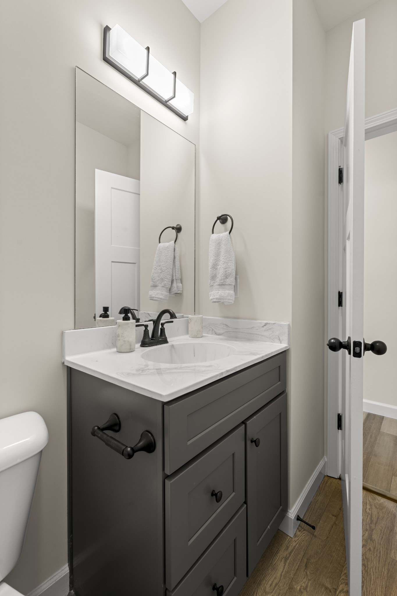 1007 Edgewood Drive Dickson, TN 37055 - Photo 15 of 25 a bathroom with a granite countertop sink a toilet and a mirror