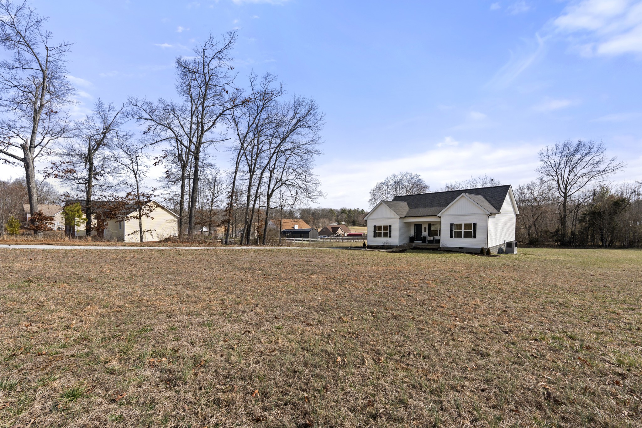 1007 Edgewood Drive Dickson, TN 37055 - Photo 24 of 25 a front view of a house with a yard covered with snow