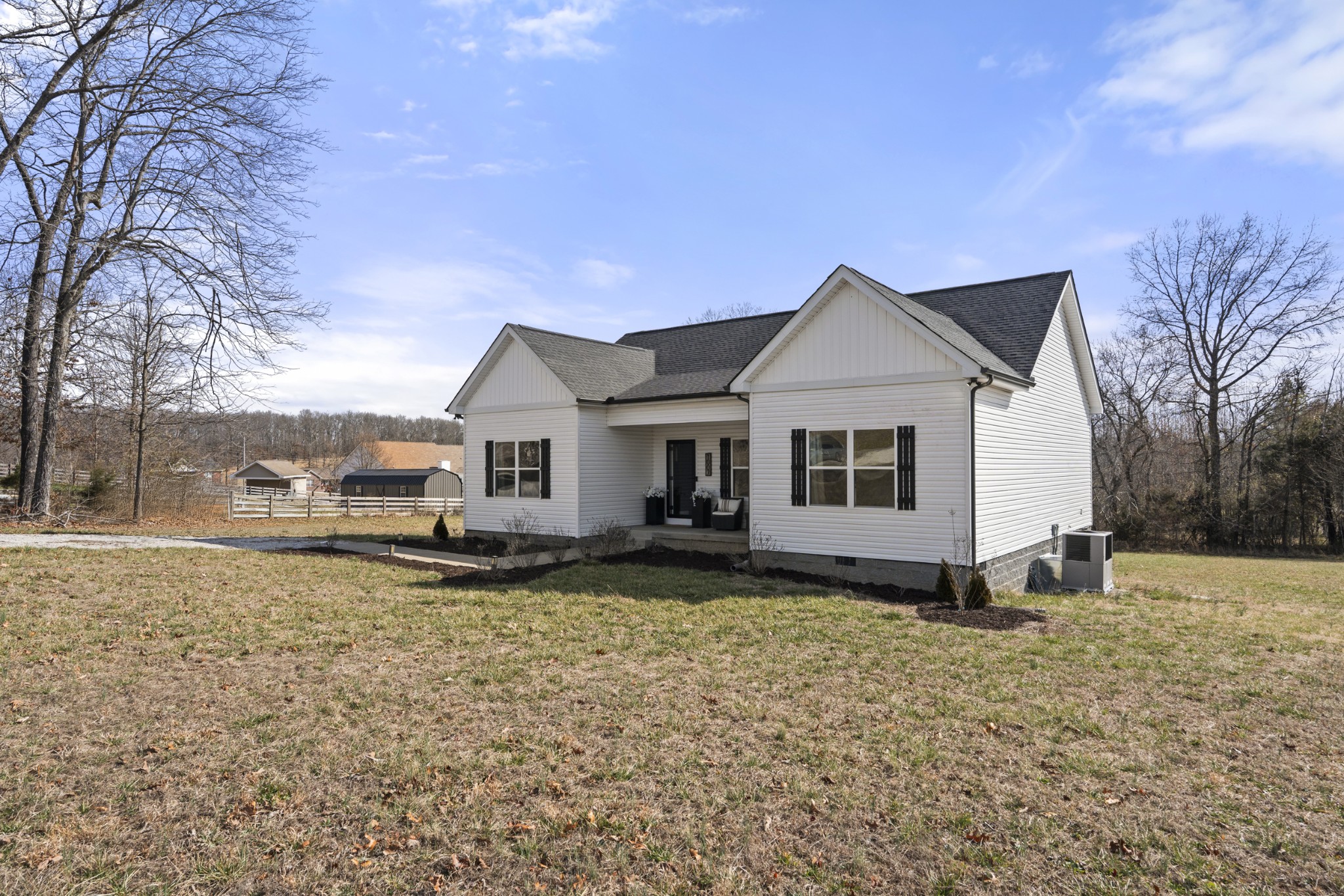 1007 Edgewood Drive Dickson, TN 37055 - Photo 3 of 25 a view of a house with a yard covered in snow