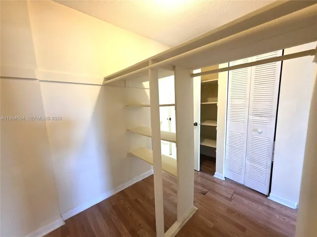 a view of entryway with wooden floor