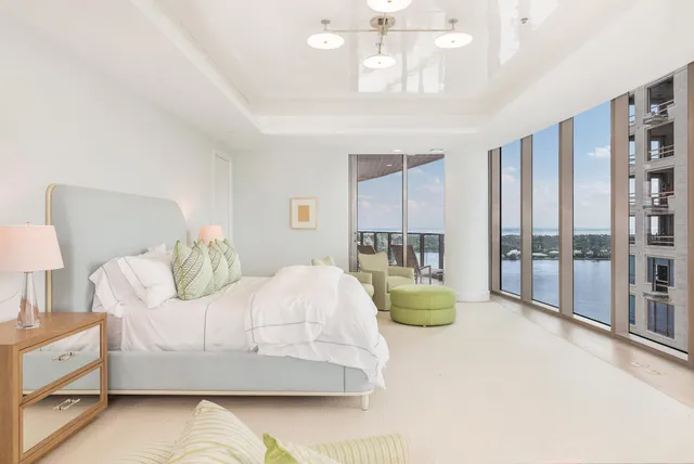 a bedroom with bed and window