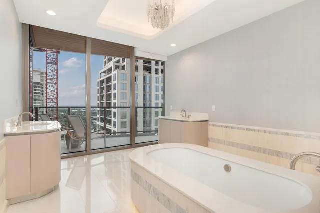 a bathroom with a bathtub and shower